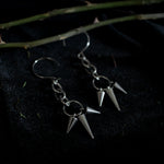 Load image into Gallery viewer, Pair of silver earrings dangling with short and long spikes hanging from chain links.
