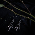 Load image into Gallery viewer, Pair of silver earrings dangling with short and long spikes hanging from chain links.
