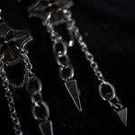 Load image into Gallery viewer, Pair of silver earrings with chained spikes dangling from floral checkered pendant.
